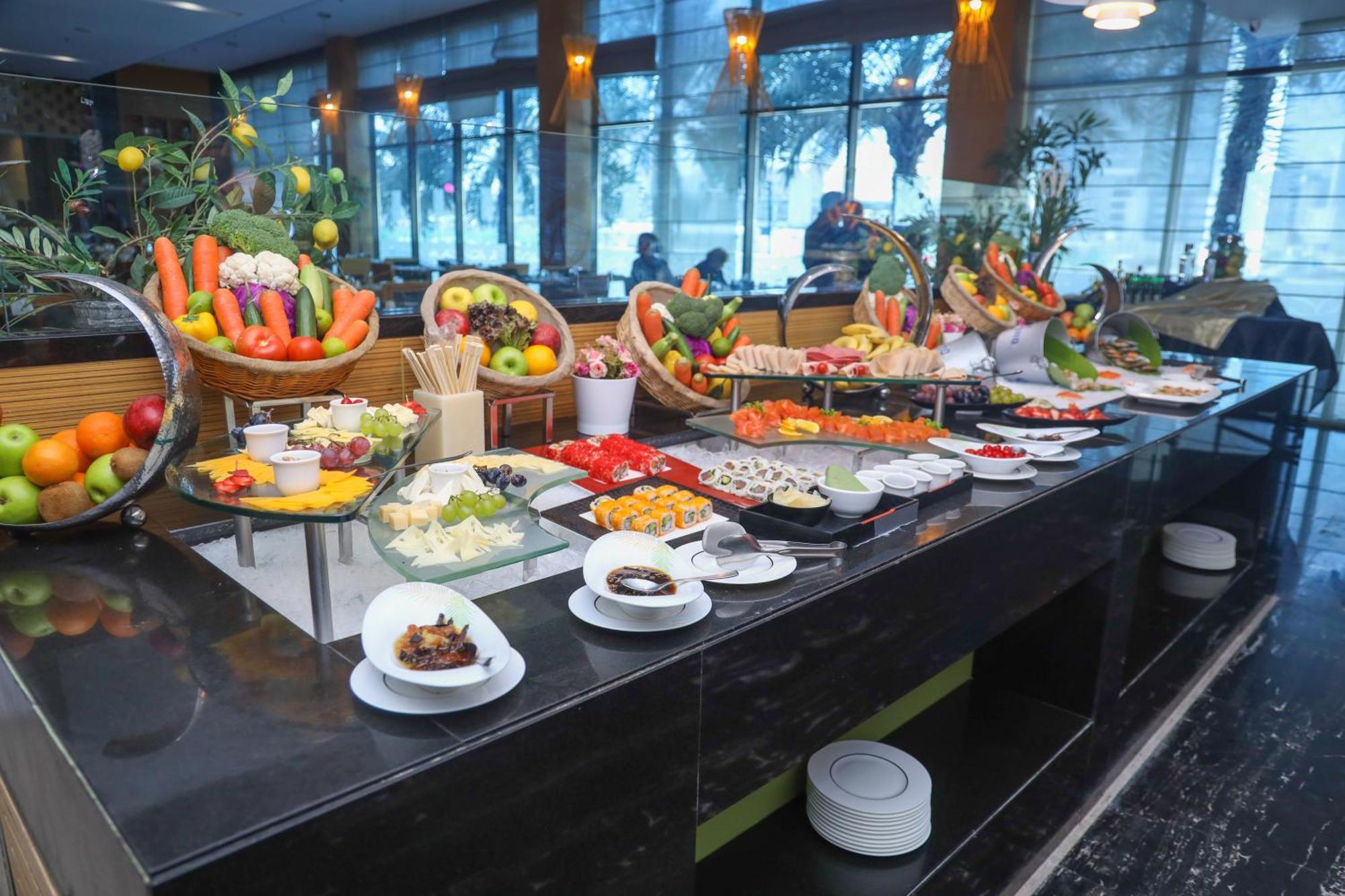 Ramee Grand Hotel And Spa Manama Exterior photo A buffet at a hotel
